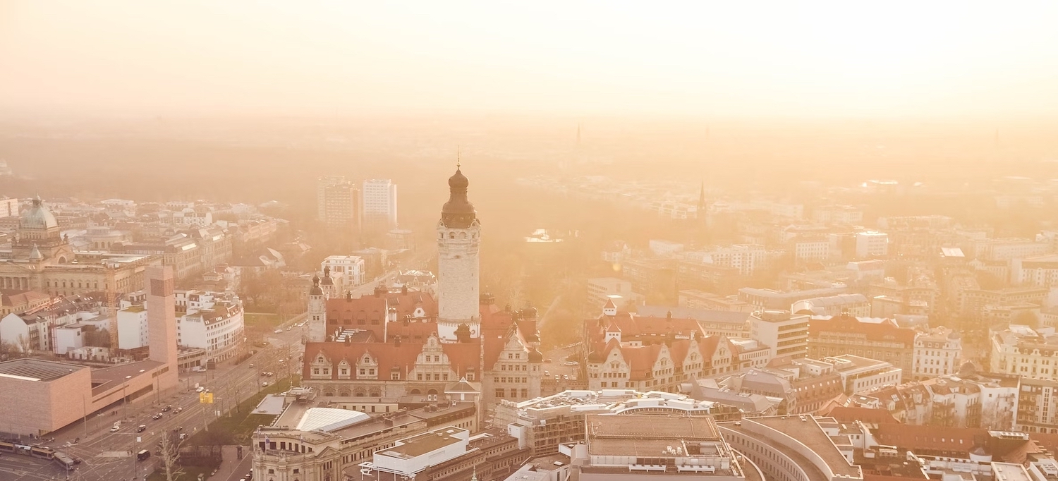 Aerial view of a city bathing in golden morning light.