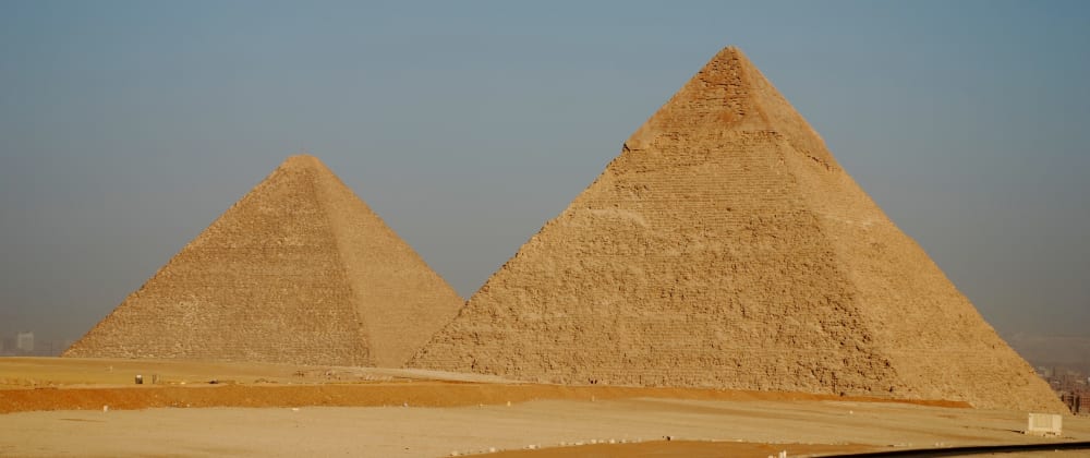 Two Cairo pyramids against a clear sky