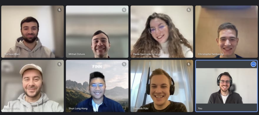 Eight people in a Google Meet group call, smiling.