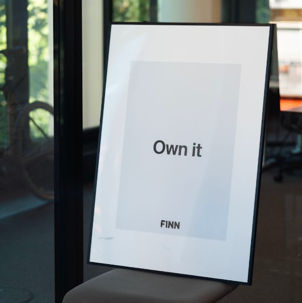 Framed picture with the text &ldquo;Own it&rdquo; inside